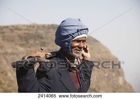 Stock Photography - Local armed guard with trekking group, Simien Mountains National Park; Asmara region, Ethiopia. Fotosearch