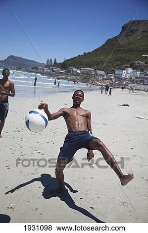 Local Boys Playing Football On Beach, Muizenberg, Cape Town; Local Boys Playing Football On Beach, Muizenberg, Cape Town, South Africa View Large Photo Image Stock Photo - Local Boys Playing Football On Beach, Muizenberg, Cape Town; Local Boys Playing Football On Beach, Muizenberg, Cape Town, South Africa. Fotosearch