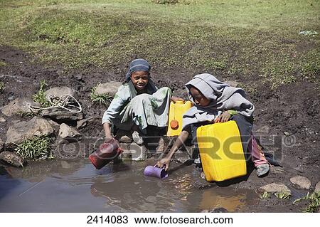 Local children collecting water, near Gondar; Amhara region, Ethiopia View Large Photo Image Stock Image - Local children collecting water, near Gondar; Amhara region, Ethiopia. Fotosearch