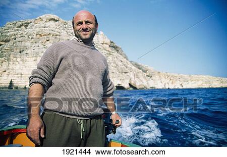 Local Fisherman Out In His Boat View Large Photo Image Picture - Local Fisherman Out In His Boat. Fotosearch