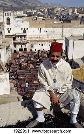 Stock Image - Local Guide Sitting Above The Tannery. Fotosearch