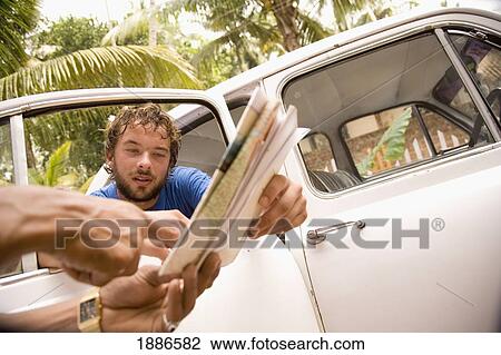 Local Man Helping Backpacker With Directions View Large Photo Image Stock Image - Local Man Helping Backpacker With Directions. Fotosearch