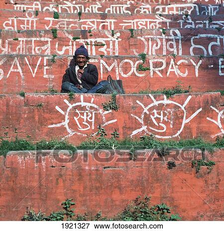 Stock Photo - Local Man Sitting On Steps. Fotosearch