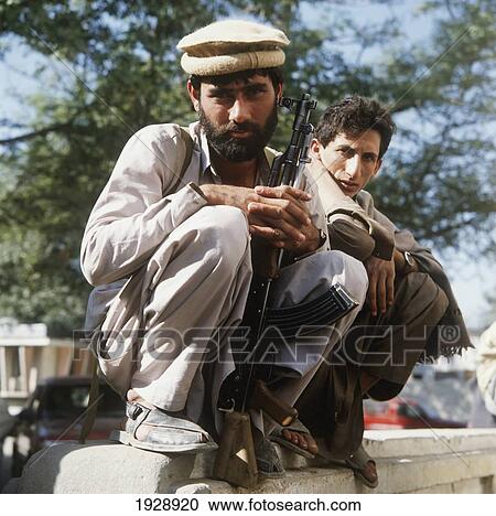 Stock Image - Local Man With Ak47 Gun. Fotosearch