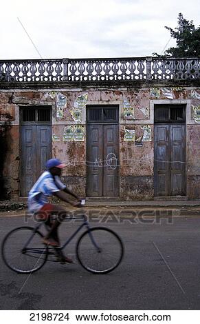 Local On A Bike, Sao Tome Town View Large Photo Image Picture - Local On A Bike, Sao Tome Town. Fotosearch