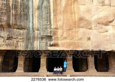 Stock Photograph - Local tourists at fifth century cave temples; Badami, Karnataka, India. Fotosearch