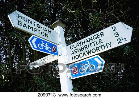 Stock Image - Local Village Signpost For Huntsham, Bampton, Clayhanger, Ashbrittle And Hockworthy, Mid Devon, South West, Uk. Fotosearch