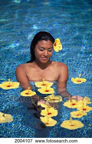 Local Woman In Water Surrounded By Tropical Flowers, Yellow Hibiscus View Large Photo Image Stock Photo - Local Woman In Water Surrounded By Tropical Flowers, Yellow Hibiscus. Fotosearch
