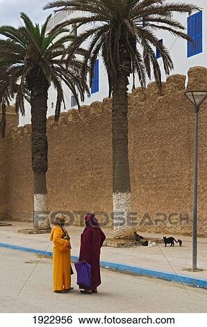 Stock Photograph - Local Women Dressed In Traditional Haik. Fotosearch
