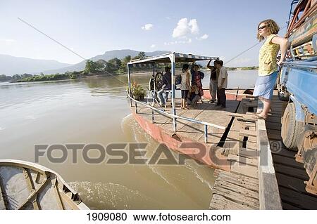Locals And Tourist On Ferry On Mekong River, Champasak, Southern Laos View Large Photo Image Stock Image - Locals And Tourist On Ferry On Mekong River, Champasak, Southern Laos. Fotosearch