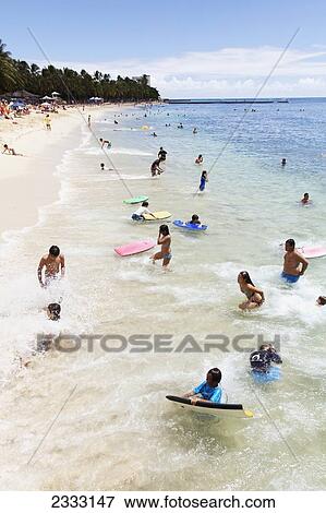 Locals and tourists swim and play in ocean at Waikiki Beach; Waikiki, Oahu, Hawaii, United States of America View Large Photo Image Stock Photo - Locals and tourists swim and play in ocean at Waikiki Beach; Waikiki, Oahu, Hawaii, United States of America. Fotosearch
