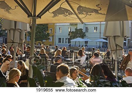 Stock Photography - Locals At Riverside Cafe, Ljubljana, Slovenia. Fotosearch