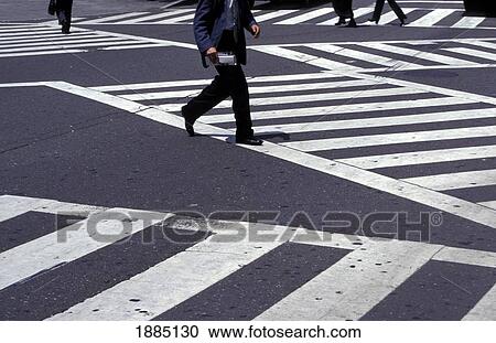 Stock Image - Locals Crossing The Street In Ginza, Low Angle View. Fotosearch