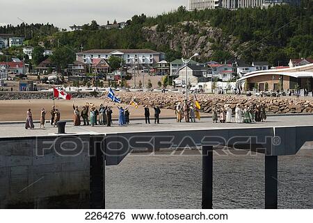 Locals in costumes welcoming cruise ship with folk dancing and flag waving; saguenay quebec canada View Large Photo Image Stock Photograph - Locals in costumes welcoming cruise ship with folk dancing and flag waving; saguenay quebec canada. Fotosearch