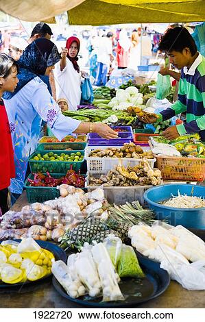 Stock Image - Locals Shopping At Road Side Market. Fotosearch