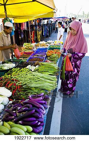 Locals Shopping At Road Side Market View Large Photo Image Stock Photo - Locals Shopping At Road Side Market. Fotosearch
