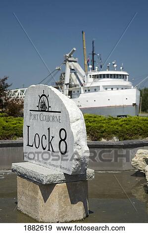 Lock 8 Port Colborne Sign With A Ship In The Background; Port Colborne, Ontario, Canada View Large Photo Image Stock Photo - Lock 8 Port Colborne Sign With A Ship In The Background; Port Colborne, Ontario, Canada. Fotosearch