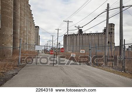 Stock Photo - Locked gate to an industrial area at the port of buffalo; buffalo new york usa. Fotosearch