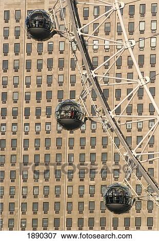 Stock Photo - London Eye Capsules, Office Building In Background. Fotosearch