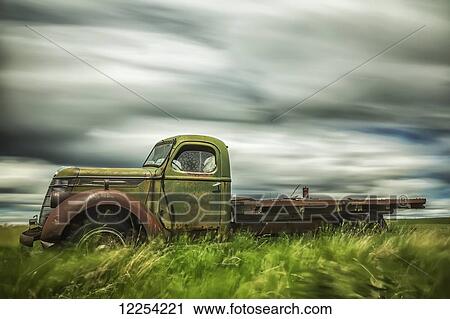 Long exposure of clouds drifting by over an abandoned truck; Saskatchewan, Canada View Large Photo Image Stock Image - Long exposure of clouds drifting by over an abandoned truck; Saskatchewan, Canada. Fotosearch