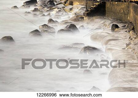 Long exposure of surf over rocks; Kapaa, Kauai, Hawaii, United States of America View Large Photo Image Stock Photograph - Long exposure of surf over rocks; Kapaa, Kauai, Hawaii, United States of America. Fotosearch