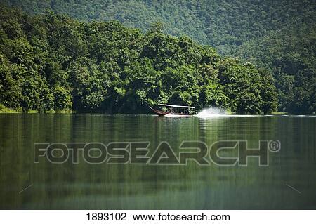 Long-Tail Boat On The Mae Ngat Dam; Chiang Mai, Thailand View Large Photo Image Stock Image - Long-Tail Boat On The Mae Ngat Dam; Chiang Mai, Thailand. Fotosearch