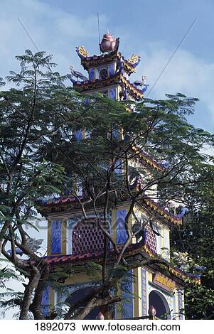 Stock Image - Long Tuyen Pagoda Behind Tree. Fotosearch