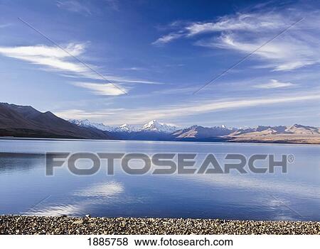 Looking Across Lake Pukaki At Dusk To Mount Cook And Southern Alps View Large Photo Image Stock Photo - Looking Across Lake Pukaki At Dusk To Mount Cook And Southern Alps. Fotosearch