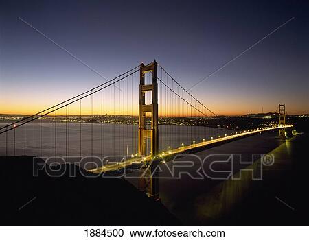 Stock Image - Looking Across The Golden Gate Bridge At Dawn With San Francisco Behind. Fotosearch
