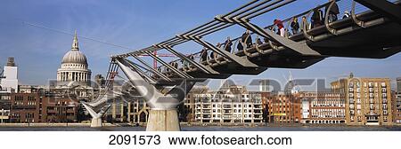 Looking Across The Thames And Along The Millenium Bridge Towards St Pauls Cathedral, London, Uk. View Large Photo Image Stock Image - Looking Across The Thames And Along The Millenium Bridge Towards St Pauls Cathedral, London, Uk.. Fotosearch
