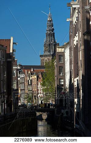Looking along canal to the Oude Lutherse Kerk church; Amsterdam, Holland View Large Photo Image Stock Photo - Looking along canal to the Oude Lutherse Kerk church; Amsterdam, Holland. Fotosearch