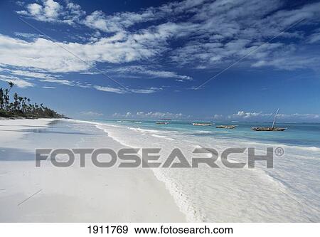 Looking Along Matemwe Beach Towards Mnemba Island, Zanzibar, Tanzania. View Large Photo Image Stock Photo - Looking Along Matemwe Beach Towards Mnemba Island, Zanzibar, Tanzania.. Fotosearch