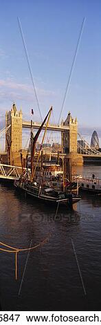 Looking Along Thames Towards Dutch Barges, Tower Bridge And The City, London, Uk. View Large Photo Image Stock Photo - Looking Along Thames Towards Dutch Barges, Tower Bridge And The City, London, Uk.. Fotosearch