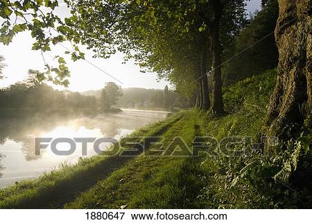 Looking Along The Nantes-Brest Canal On A Misty Morning View Large Photo Image Stock Photo - Looking Along The Nantes-Brest Canal On A Misty Morning. Fotosearch