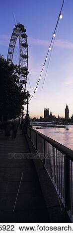Looking Along The Thames At Dusk Towards The London Eye, Big Ben And The Houses Of Parliament, London, Uk. View Large Photo Image Stock Image - Looking Along The Thames At Dusk Towards The London Eye, Big Ben And The Houses Of Parliament, London, Uk.. Fotosearch