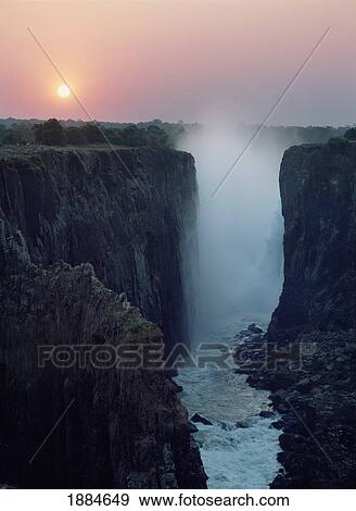 Looking Along Victoria Falls At Dusk From Zambia To Zimbabwe View Large Photo Image Stock Photo - Looking Along Victoria Falls At Dusk From Zambia To Zimbabwe. Fotosearch
