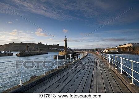 Stock Image - Looking Back Along Pier To Town And Ruins Of Abbey. Fotosearch