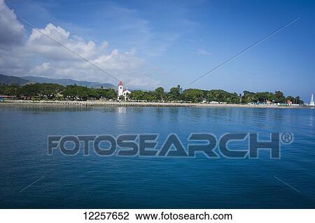Stock Image - Looking back onto central Dili from the water; Dili, Timor-Leste. Fotosearch
