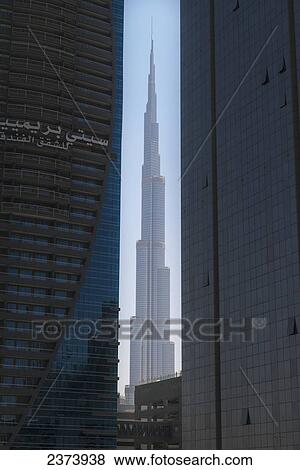 Stock Photo - Looking between two tall office buildings to the Burj Khalifa; Dubai, United Arab Emirates. Fotosearch