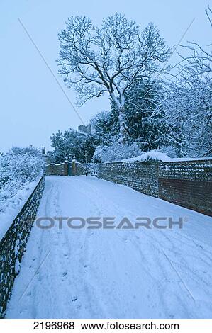 Stock Photo - Looking Down Path Blanketed In Snow To Castle Before Dawn, Lewes, East Sussex, England.. Fotosearch