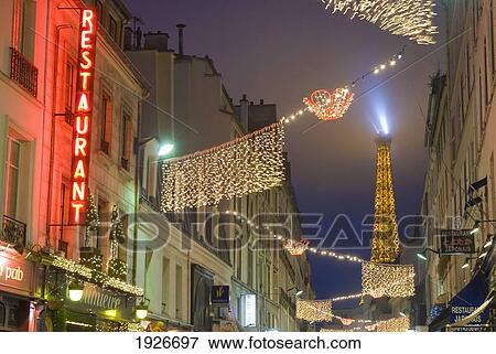 Looking Down Rue St Dominique At Dusk Towards The Eiffel Tower, Paris, France View Large Photo Image Stock Photo - Looking Down Rue St Dominique At Dusk Towards The Eiffel Tower, Paris, France. Fotosearch