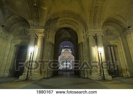 Looking Down The Passage Richelieu Of The Louvre Museum To The Glass Pyramid At Night. View Large Photo Image Stock Photo - Looking Down The Passage Richelieu Of The Louvre Museum To The Glass Pyramid At Night.. Fotosearch