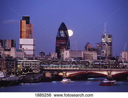 Looking Down The Thames At Dusk To Full Moon Rising Behind The Swiss Re Building View Large Photo Image Stock Photograph - Looking Down The Thames At Dusk To Full Moon Rising Behind The Swiss Re Building. Fotosearch