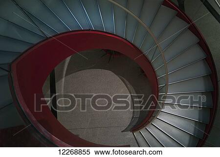 Stock Photography - Looking down through a spiral staircase at the Charles de Gaulle Airport, Paris, France. Fotosearch
