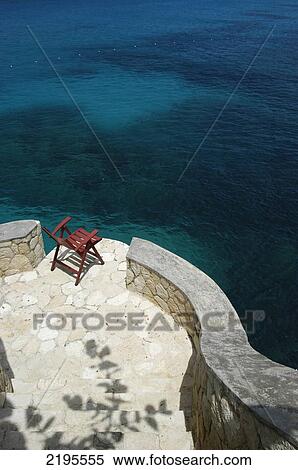 Stock Photography - Looking Down To Deck Chairs Beside The Sea, The Caves, Negril, Jamaica.. Fotosearch