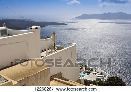 Stock Photo - Looking from the the town of Fira towards the islands of Nea Kameni and Therasia; Fira, Santorini, Cyclades, Greek Islands, Greece. Fotosearch
