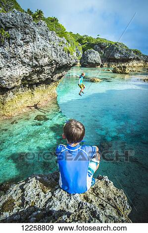 Stock Photo - Looking out over a popular swimming hole; Niue Island. Fotosearch