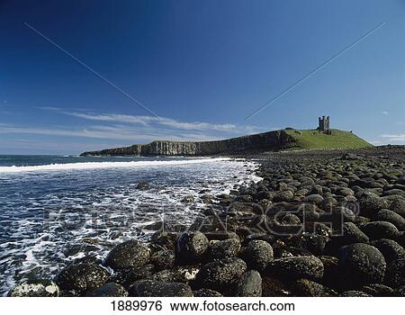 Looking Over Boulders To Dunstanburgh Castle View Large Photo Image Stock Photograph - Looking Over Boulders To Dunstanburgh Castle. Fotosearch