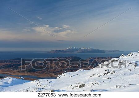Stock Image - Looking over to the islands of Eigg and Rum from Beinn Respiol, Ardnamurchan peninsula; Highlands, Scotland. Fotosearch