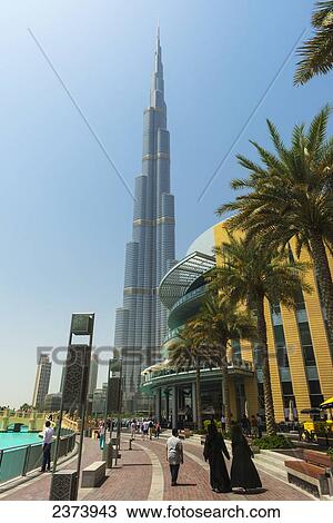 Stock Image - Looking past the Dubai Mall towards the Burj Khalifa; Dubai, United Arab Emirates. Fotosearch